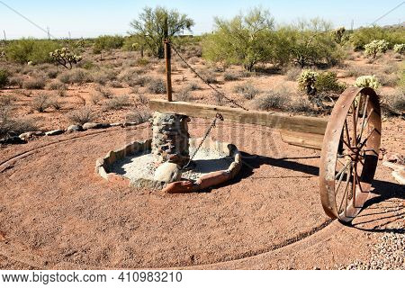 APACHE JUNCTION, AZ - DECEMBER 8, 2016: Arrastra or Mexican Rastra at the Superstition Mountain Museum. The device was a primitive method to process gold and silver ore