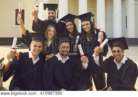 Collective Photo Of Smiling Boys And Girls Students University Graduates Celebrating Getting Diploma