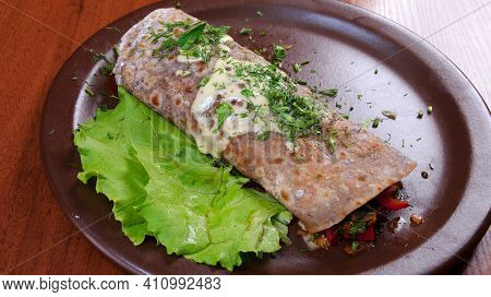 Mexican Enchiladas Rancheras, Browned Ground Beef, Tomatoes And Enchilada Sauce Wrapped In Corn Tort