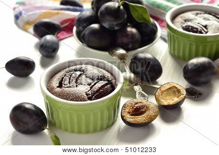 Clafoutis with plums and chocolate, selective focus