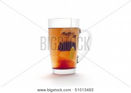 Tea with lemon in a glass cup