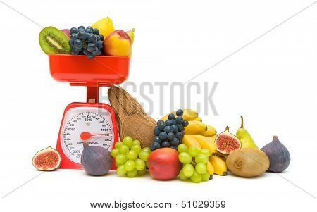 Fresh Fruit And Kitchen Scales Isolated On White Background