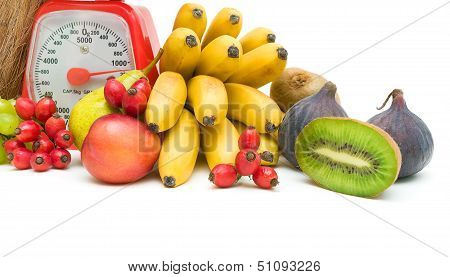 Fruit And Kitchen Scales On A White Background