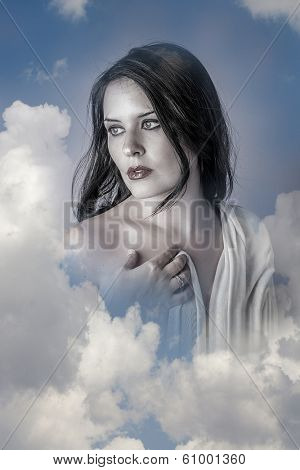 Sensual, Beautiful woman in clouds, mithology concept. Brunette with long hair and white dress.