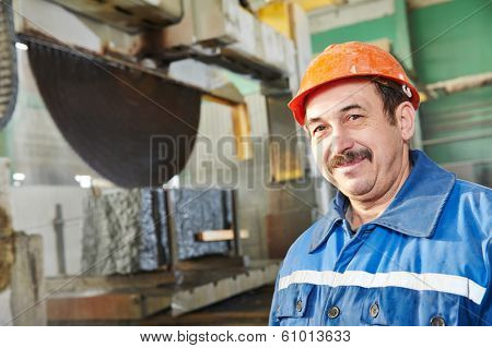 industrial worker at factory on granite or marble manufactur?