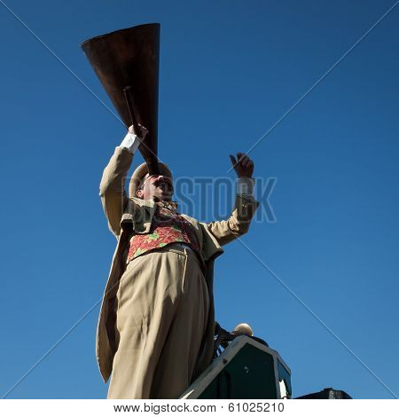 Performer Calls People Using A Vintage Loudhailer At Milan Clown Festival 2014