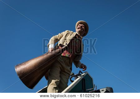 Performer Calls People Using A Vintage Loudhailer At Milan Clown Festival 2014