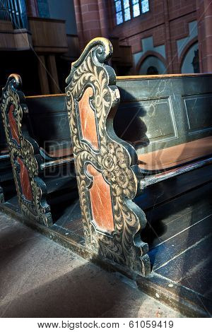 WETZLAR, GERMANY - JUNE 3, 2012: old wooden empty historic benches in the cathedral of Wetzlar