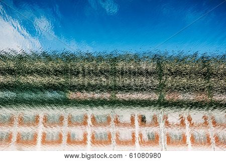 Reflection Of Coloured House On Canal Water
