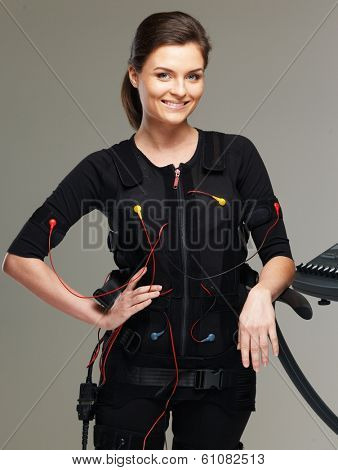 Young woman in Electro Muscular Stimulation EMS exercise training costume 