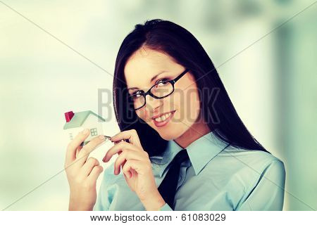 Young businesswoman  (real estate agent) with hose model 