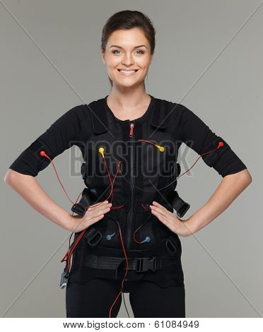 Young woman in Electro Muscular Stimulation EMS exercise training costume 