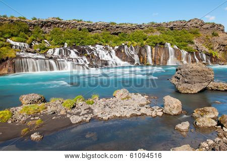 Hraunfossar is a very beautiful Icelandic waterfall in the west of the island. It comes from the lava field and pours into the Hvita river with a incredibly blue water. Long exposure.