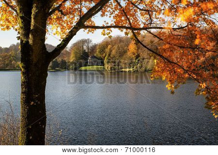 Trees and main lake in Stourhead Gardens during Autumn.