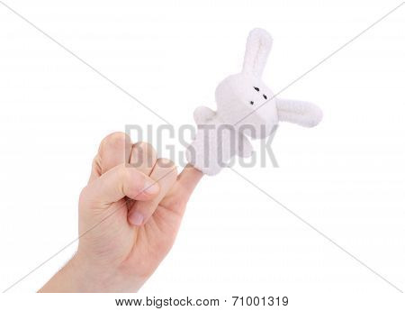 Finger wearing puppet rabbit.