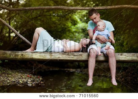 Happy family by the river