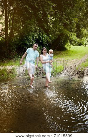 Happy family by the river
