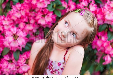 Daydreaming little girl, outdoors