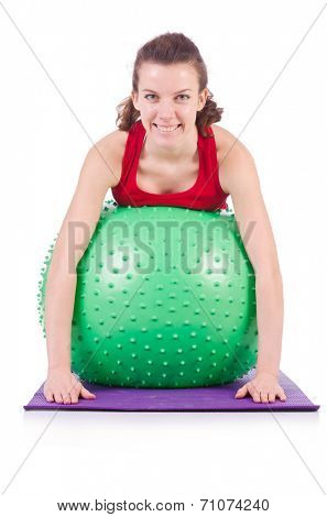Young woman exercising with swiss ball