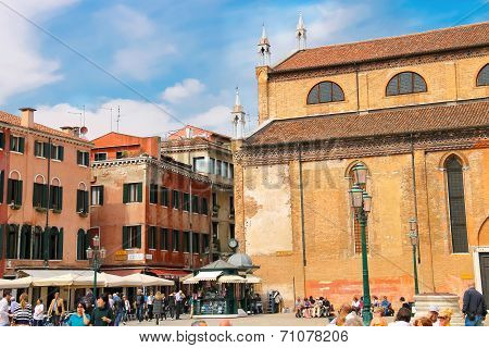 Tourists On The Square Near  Church Santa Maria Gloriosa Dei Frari. Venice, Italy