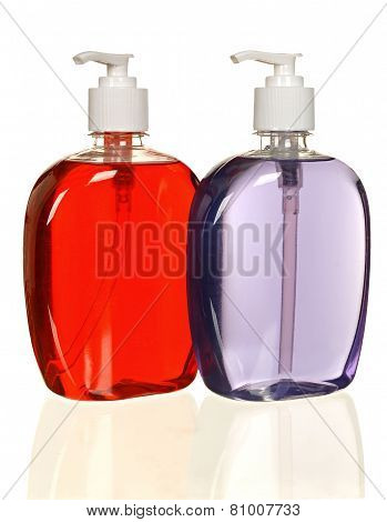 colored plastic bottles with liquid soap and shower gel.