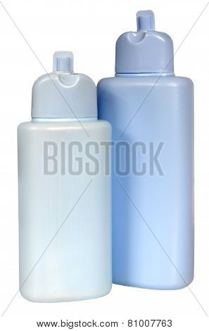 colored plastic bottles with liquid soap and shower gel.