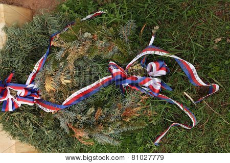 Firry wreath decorated with Czech national ribbons. 