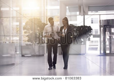 portrait of business people walking