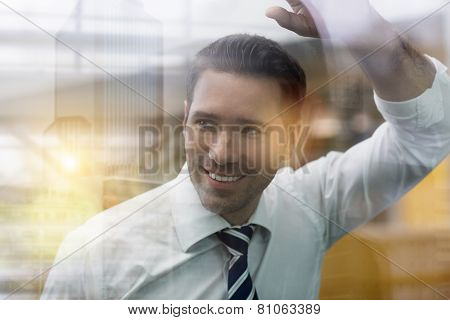 Businessman Standing Behind Glass