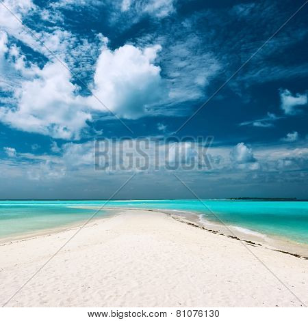 Beautiful island beach with sandspit at Maldives