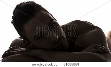 Chiaroscuro Shot Of Cute Young Man Naked Resting