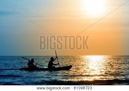 The Silhouette Of Rowing Boat