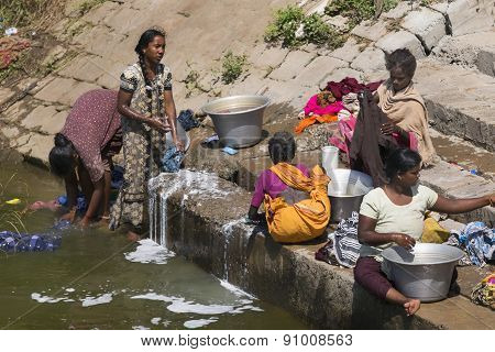 Women Doing Laundry On The Steps Of The Ghat.