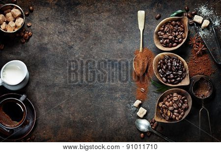 Top view of three different varieties of coffee beans on dark vintage background