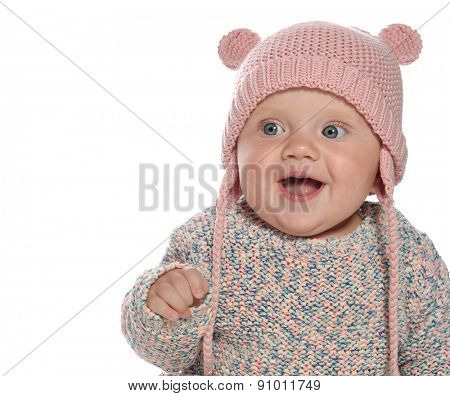 baby girl child  smiling happy pink fashion portrait face studio shot isolated on white caucasian  hat warm clothing