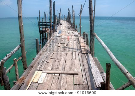 Traditional Wooden Bridge On The Beach.