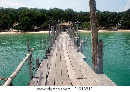 Traditional Wooden Bridge On The Beach.