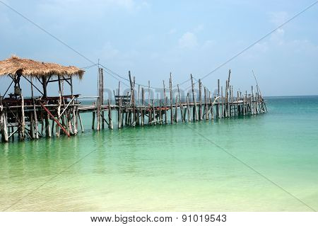 Traditional Wooden Bridge On The Beach.