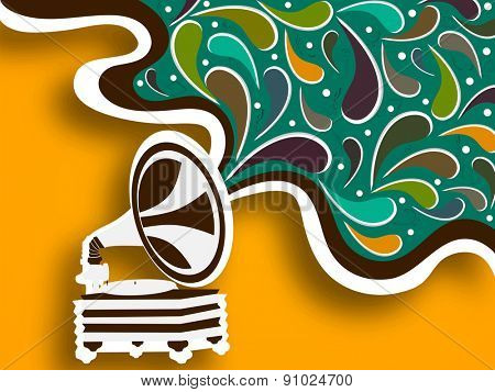 Retro musical instrument (gramophone) on stylish background.