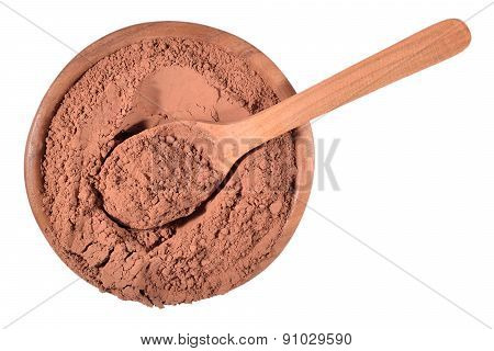 Cocoa Powder In A Wooden Spoon On A White