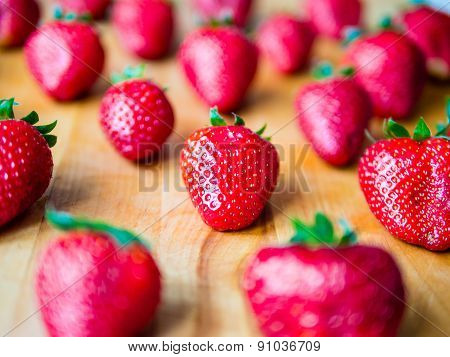 Arranged Strawberries On A Wooden Board