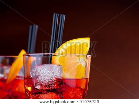 Glasses Of Spritz Aperitif Aperol Cocktail With Orange Slices And Ice Cubes With Space For Text