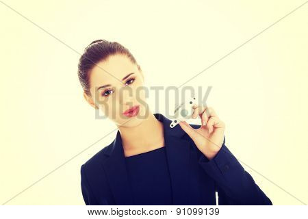 Young businesswoman with plane toy in hand