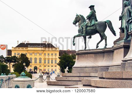 Tourists near MuseumsQuartier Wien and part of Maria TheresiaMonument in Vienna, Austria