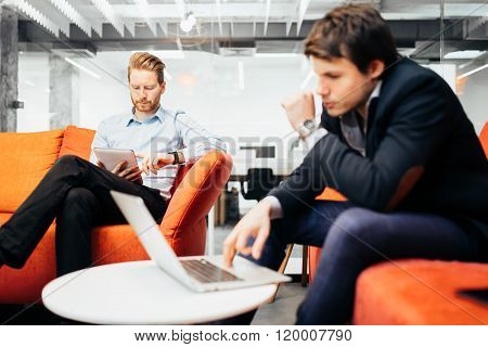 Business colleagues resting and talking during break