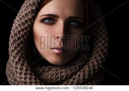 Portrait of a girl in a scarf-snood large knitted