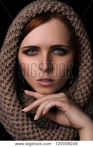 Portrait of a girl in a scarf-snood large knitted