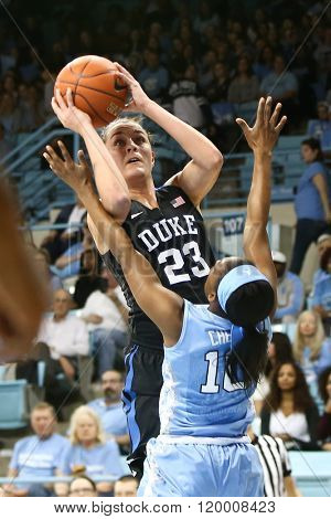 CHAPEL HILL, NC-FEB 28: Duke Blue Devils guard Rebecca Greenwell (23) shoots as University of North Carolina Tar Heels guard Jamie Cherry (10) defends on February 28, 2016 at Carmichael Arena.