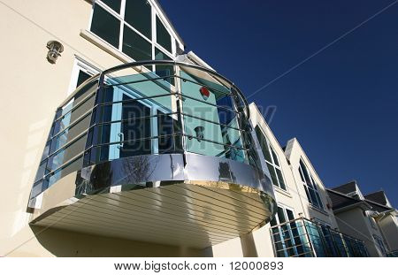 Curved Chrome Balcony on Modern House