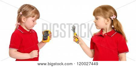 The girl holds in hand a digital multimeter and wrench